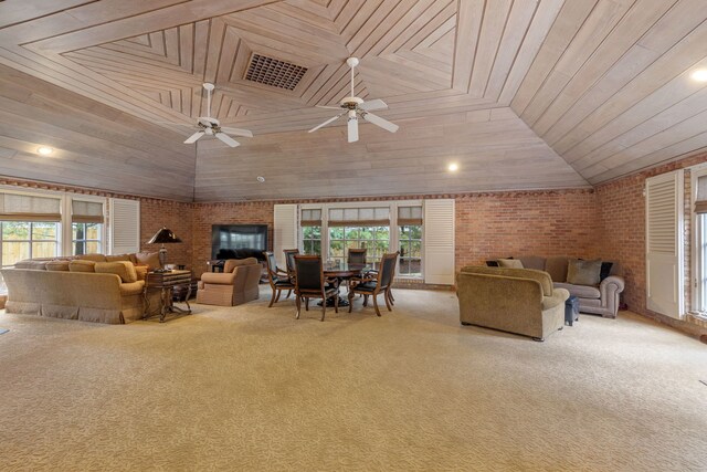 living room featuring wooden ceiling, plenty of natural light, and brick wall