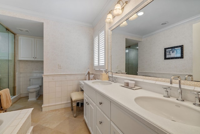 full bathroom with double vanity, crown molding, a sink, and a shower stall