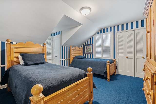 bedroom featuring a closet, vaulted ceiling, and dark carpet