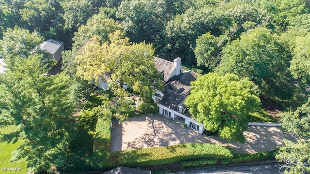 aerial view featuring a wooded view