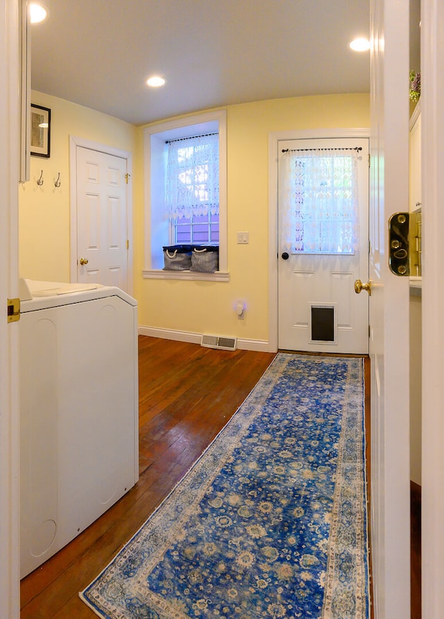 entryway featuring dark hardwood / wood-style floors and washer / clothes dryer