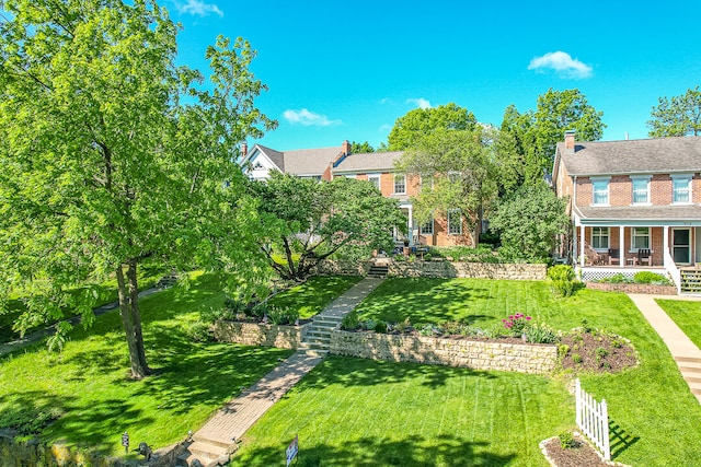 view of yard with covered porch