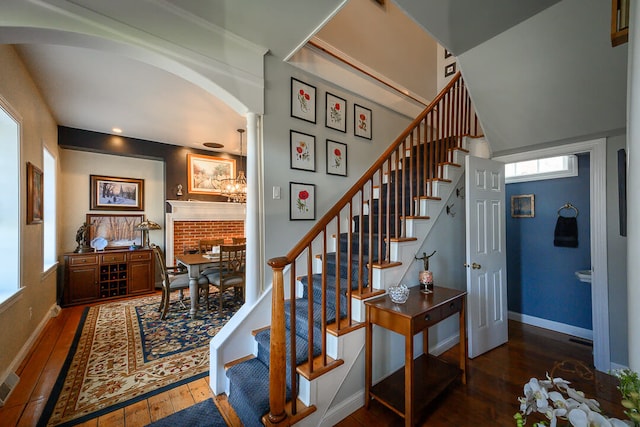 stairway featuring wood-type flooring