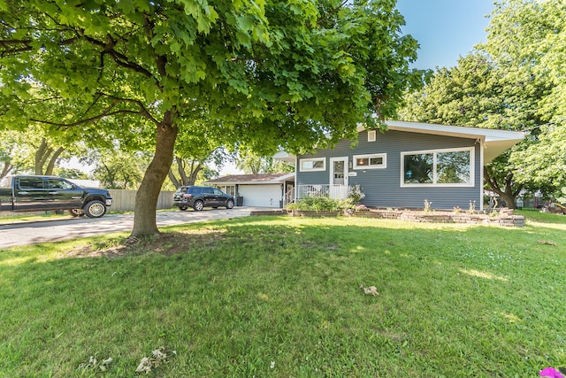 view of front of home featuring a garage and a front lawn