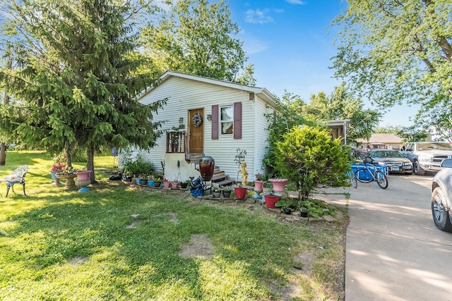 view of home's exterior with a lawn