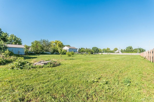 view of yard with a rural view