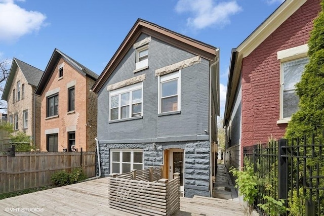 2550 W Thomas St, Chicago, IL 60622 - back of property with brick siding and fence
