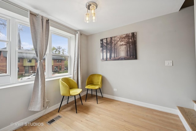 2550 W Thomas St, Chicago, IL 60622 - sitting room featuring baseboards, wood finished floors, and visible vents