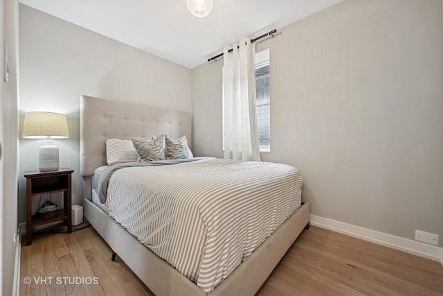 2550 W Thomas St, Chicago, IL 60622 - bedroom featuring baseboards and wood finished floors