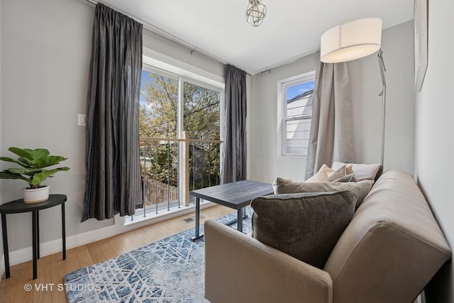 2550 W Thomas St, Chicago, IL 60622 - living area featuring visible vents, baseboards, and wood finished floors