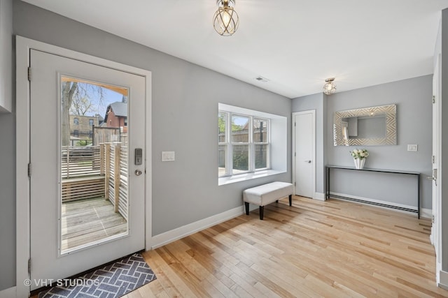 2550 W Thomas St, Chicago, IL 60622 - doorway featuring wood-type flooring, baseboards, and visible vents