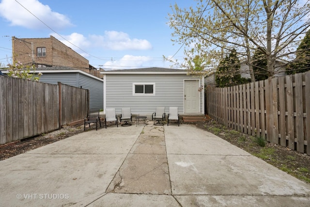 2550 W Thomas St, Chicago, IL 60622 - rear view of house with a fenced backyard, an outdoor structure, and a patio area