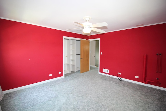 3415 W Maple St, Evergreen Park, IL 60805 - unfurnished bedroom with carpet, ornamental molding, ceiling fan, and a closet
