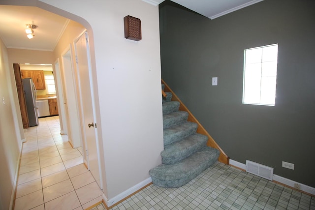 3415 W Maple St, Evergreen Park, IL 60805 - staircase with crown molding, healthy amount of natural light, arched walkways, and tile patterned flooring