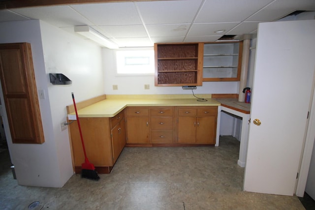 3415 W Maple St, Evergreen Park, IL 60805 - kitchen featuring open shelves, a paneled ceiling, light floors, light countertops, and brown cabinets