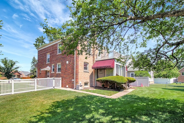 3415 W Maple St, Evergreen Park, IL 60805 - rear view of property featuring a fenced backyard and brick siding
