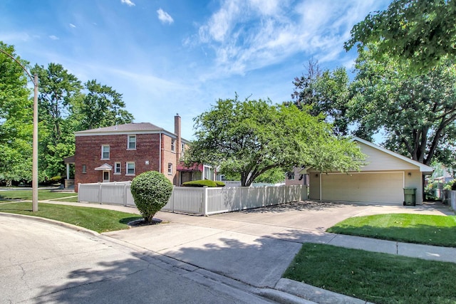 3415 W Maple St, Evergreen Park, IL 60805 - view of front of house featuring driveway, a fenced front yard, brick siding, and a garage