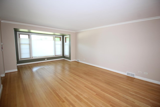 3415 W Maple St, Evergreen Park, IL 60805 - spare room featuring light wood-type flooring and crown molding