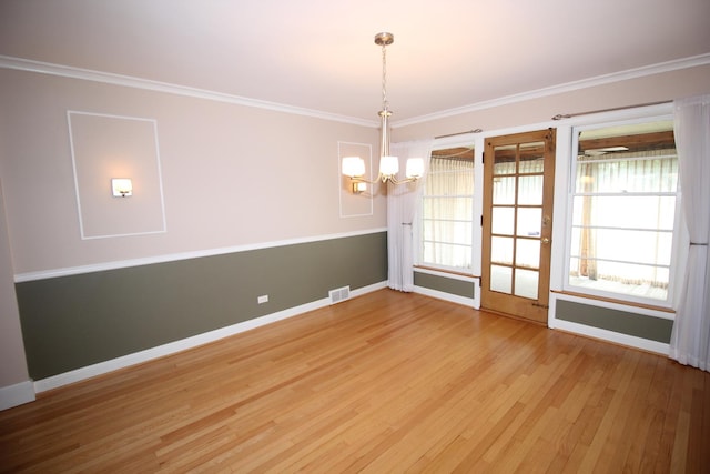 3415 W Maple St, Evergreen Park, IL 60805 - unfurnished room with a chandelier, light wood-style floors, ornamental molding, and plenty of natural light