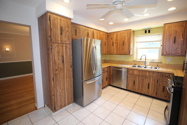 3415 W Maple St, Evergreen Park, IL 60805 - kitchen featuring appliances with stainless steel finishes, brown cabinetry, ceiling fan, light countertops, and recessed lighting