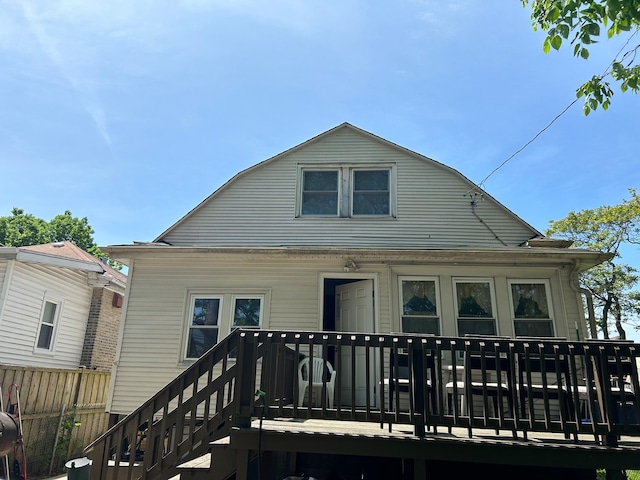 rear view of property featuring a deck