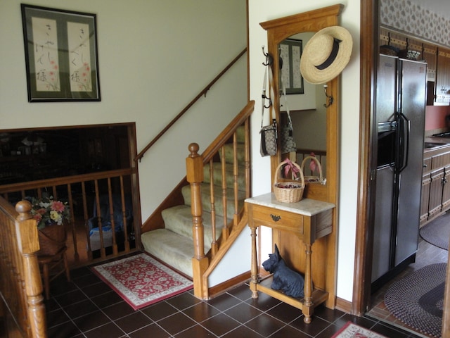 stairs with dark tile flooring