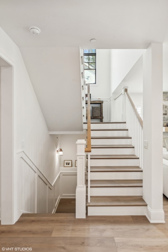 stairs with wood-type flooring