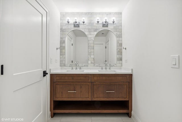 bathroom with tile floors and dual bowl vanity