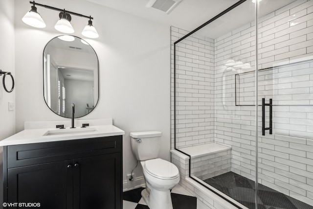 bathroom featuring a shower with shower door, oversized vanity, and toilet