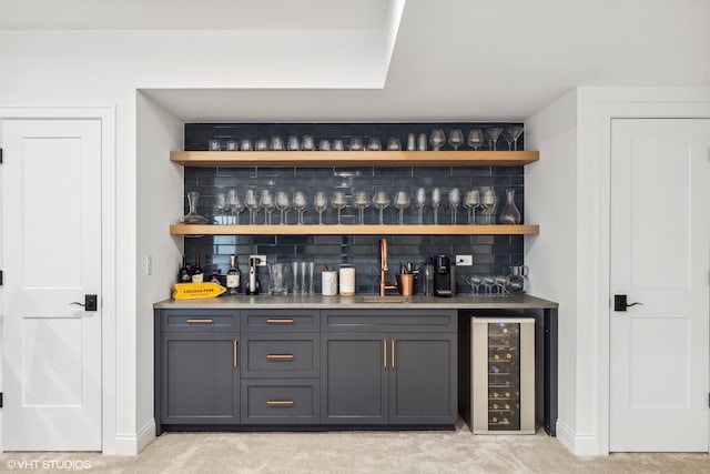 bar featuring beverage cooler, light colored carpet, and backsplash