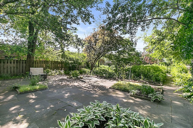 view of patio featuring fence