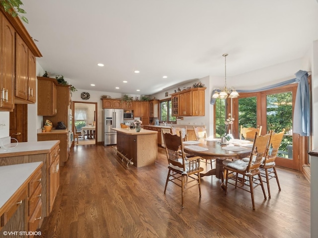 dining room featuring an inviting chandelier and dark hardwood / wood-style floors