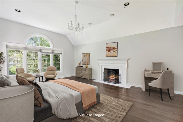 living room with dark wood-type flooring, lofted ceiling, and a notable chandelier