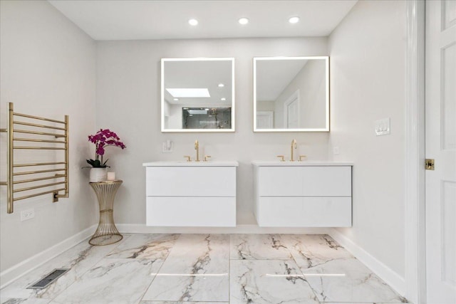 bathroom with vanity and radiator heating unit