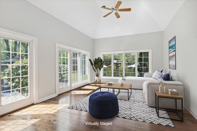 living room featuring wood-type flooring, high vaulted ceiling, and ceiling fan