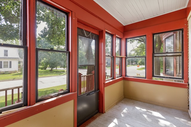 unfurnished sunroom with a wealth of natural light