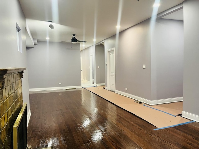 basement featuring ceiling fan and hardwood / wood-style floors