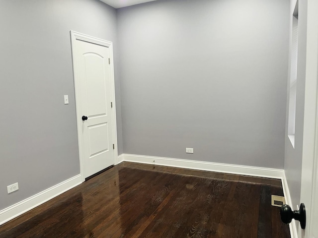 spare room featuring hardwood / wood-style floors