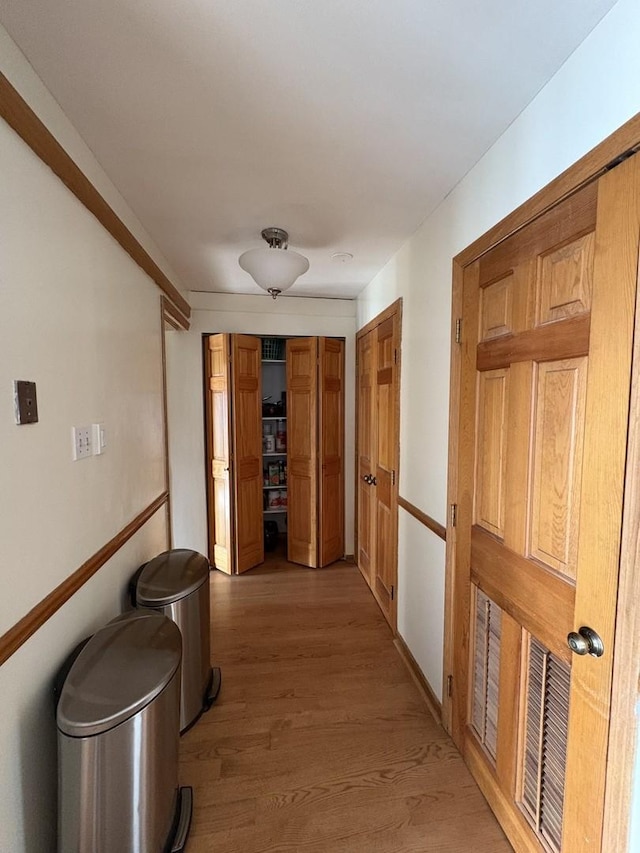 hallway featuring hardwood / wood-style flooring