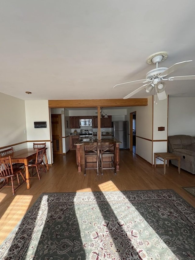 interior space featuring dark hardwood / wood-style flooring and ceiling fan