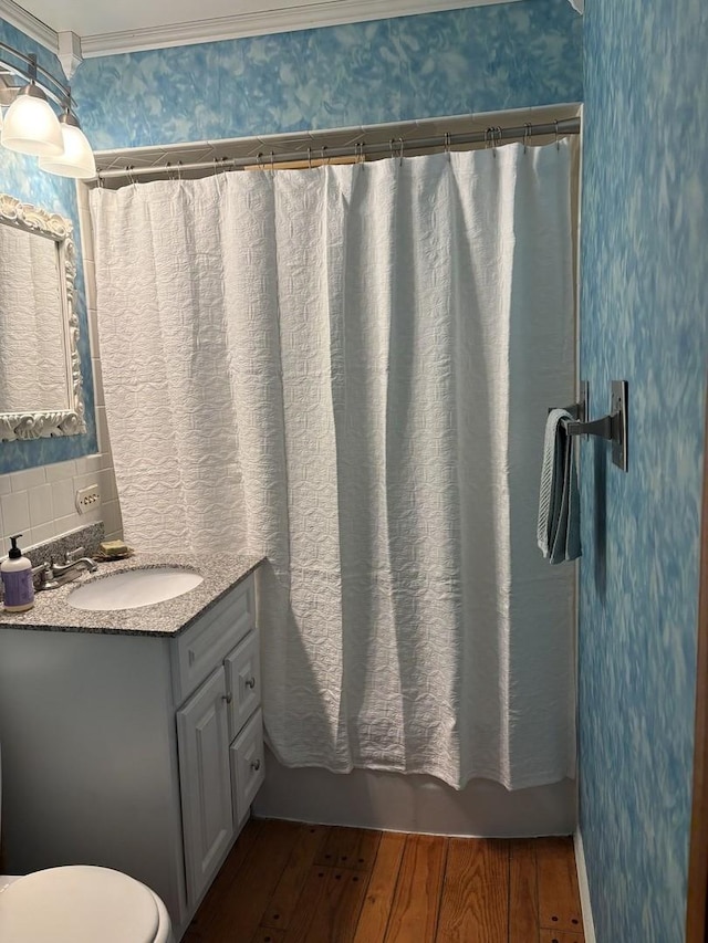 bathroom featuring vanity, tasteful backsplash, toilet, and hardwood / wood-style floors