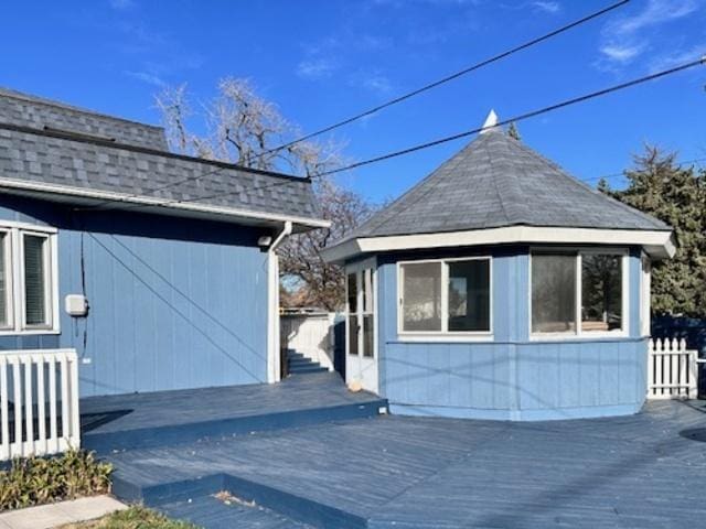 view of side of property with a wooden deck