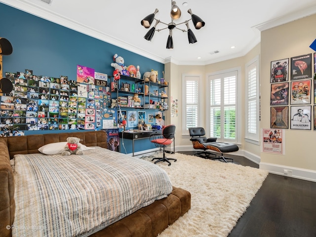 bedroom featuring hardwood / wood-style flooring, ornamental molding, and ceiling fan