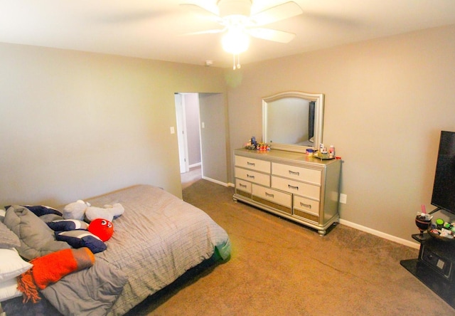 bedroom with ceiling fan and carpet floors