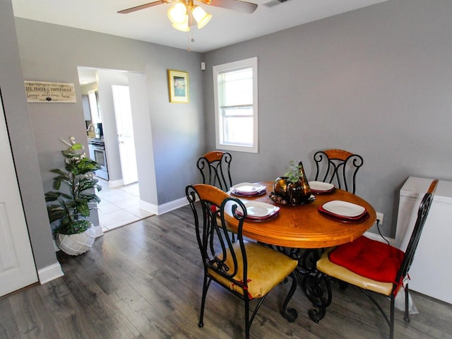 dining room featuring hardwood / wood-style flooring and ceiling fan