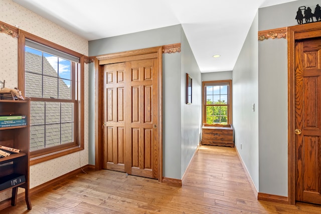 hallway with light wood-type flooring