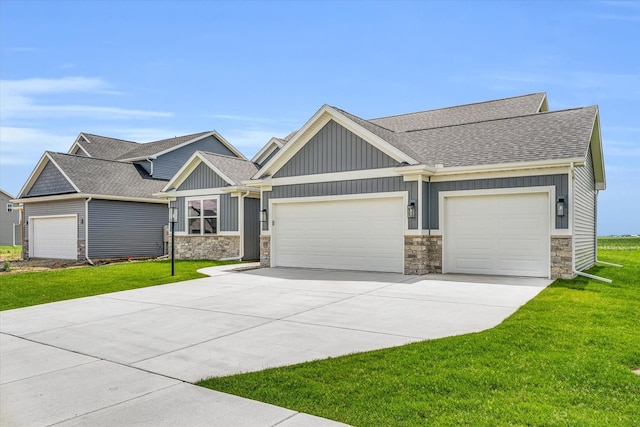 craftsman-style home featuring a garage and a front yard