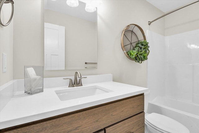 full bathroom featuring vanity, shower / bathtub combination, and toilet