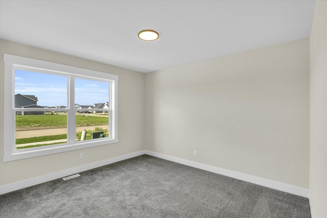 empty room featuring carpet flooring