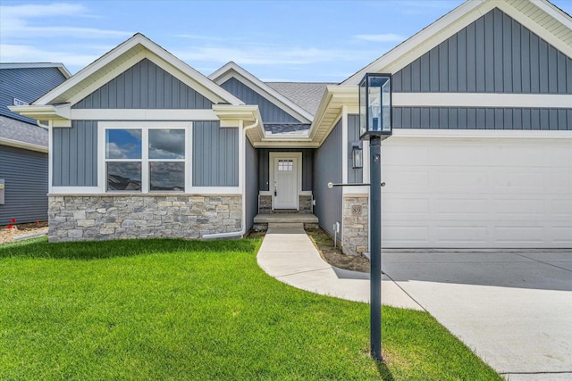 view of front of house with a front yard and a garage